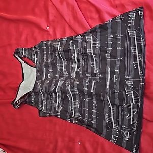 Brand new tank top with music notes and has a Racer back.